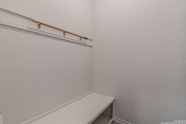 mudroom with a textured wall