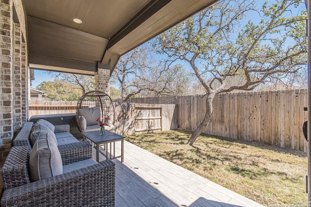 view of patio / terrace featuring a wooden deck and a fenced backyard