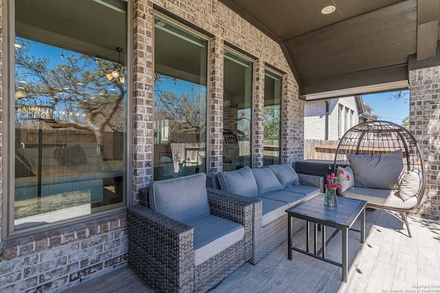 view of patio featuring an outdoor living space and fence