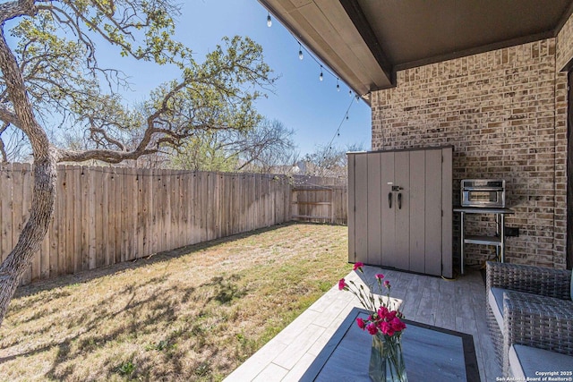 view of yard with a fenced backyard