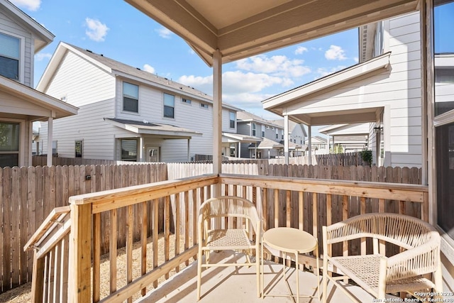 wooden deck with fence and a residential view