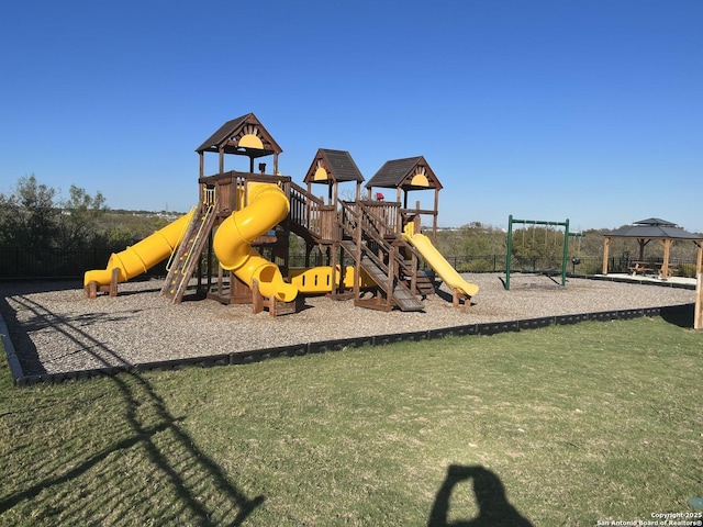 community play area with a lawn