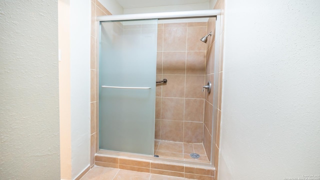 full bath featuring a stall shower