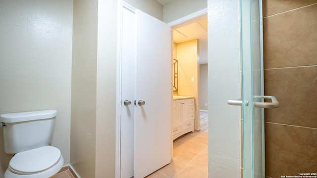 bathroom with tile patterned floors, toilet, and vanity