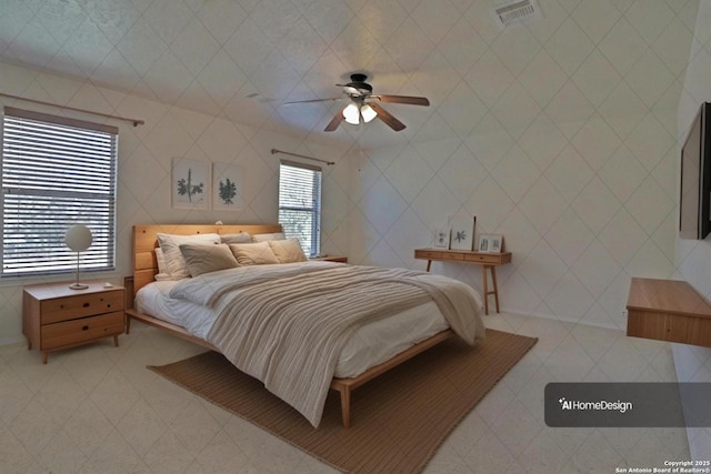 bedroom with light tile patterned floors, visible vents, and a ceiling fan