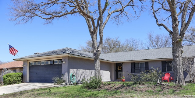 single story home with brick siding, an attached garage, and concrete driveway