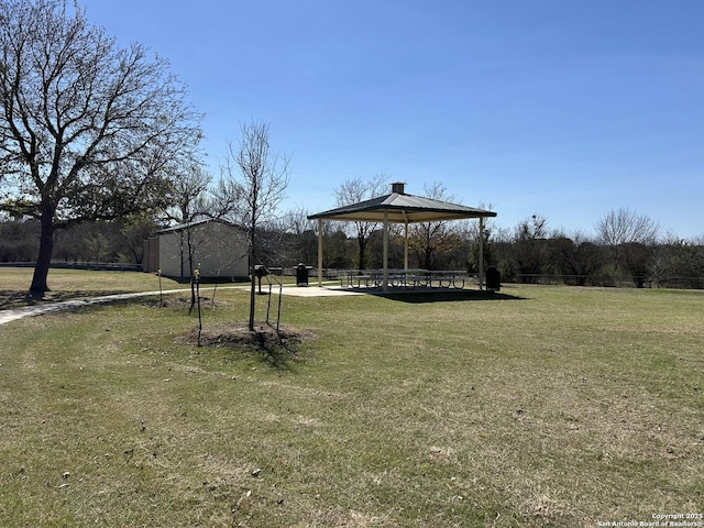 view of home's community with a gazebo and a lawn