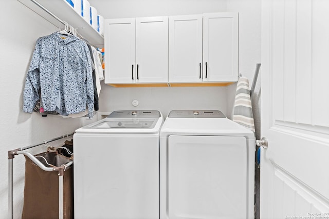 laundry area featuring cabinet space and washing machine and dryer