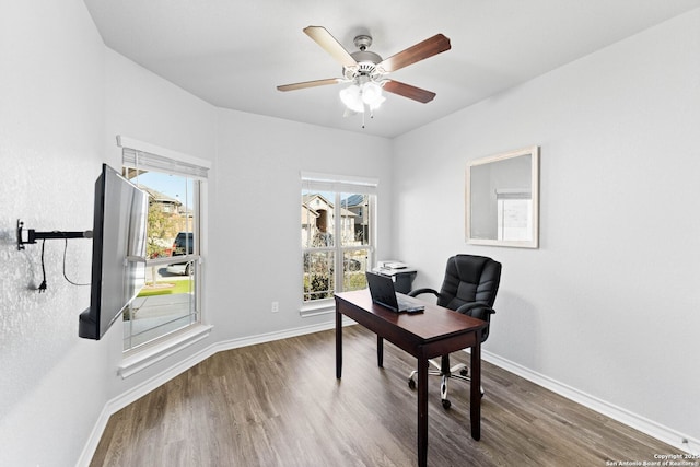 home office with ceiling fan, baseboards, and wood finished floors