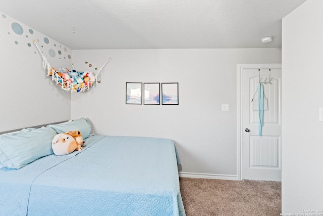 bedroom featuring carpet flooring and baseboards