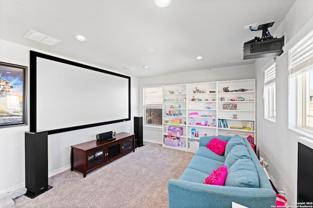 home theater featuring a wealth of natural light, visible vents, recessed lighting, and carpet floors