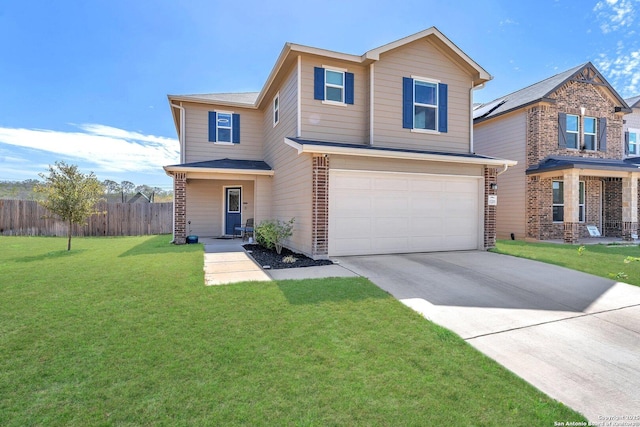 traditional-style home with a front yard, fence, driveway, a garage, and brick siding