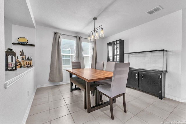 dining room with visible vents, baseboards, and light tile patterned flooring