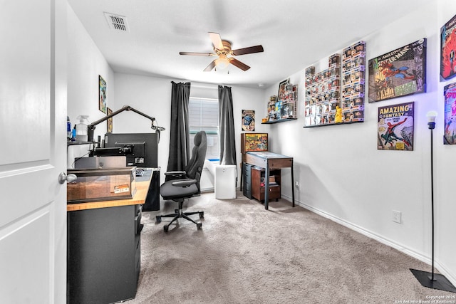 office featuring a ceiling fan, baseboards, visible vents, and carpet floors