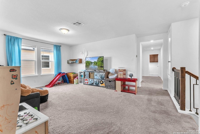 playroom featuring visible vents and carpet