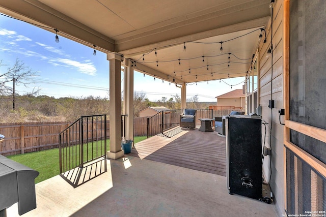 view of patio / terrace featuring a deck and a fenced backyard