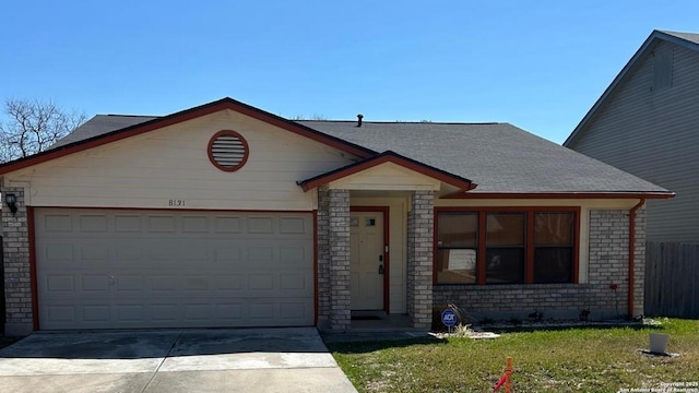 view of front of home featuring a front lawn, fence, roof with shingles, concrete driveway, and a garage