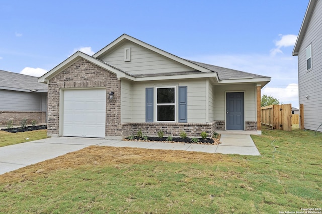 view of front of house with brick siding, an attached garage, driveway, and a front lawn