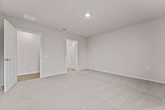 unfurnished room featuring baseboards and carpet floors