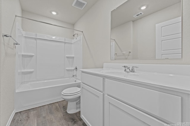 full bathroom featuring visible vents, toilet, wood finished floors, and vanity