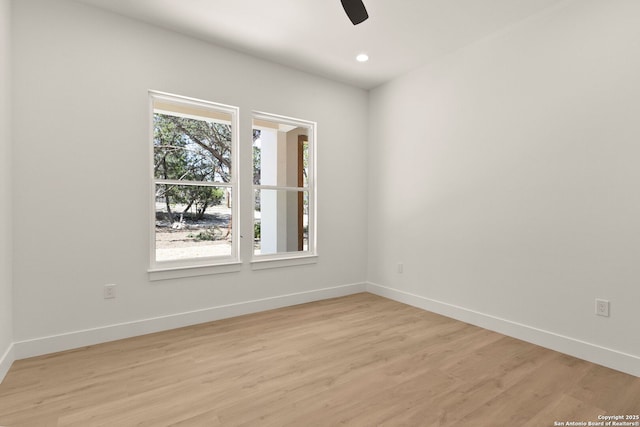 spare room featuring recessed lighting, light wood-style flooring, baseboards, and ceiling fan