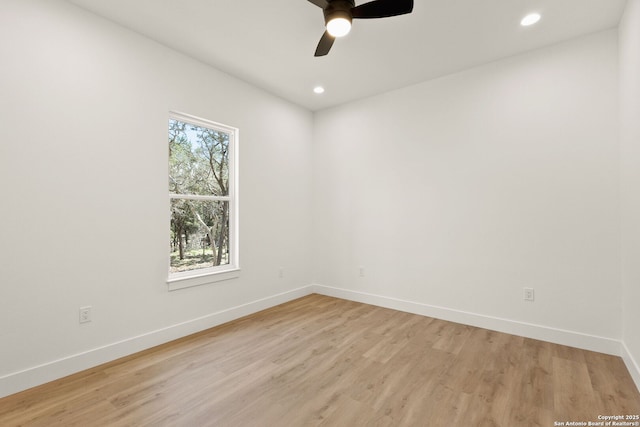 spare room with recessed lighting, baseboards, light wood-style floors, and a ceiling fan