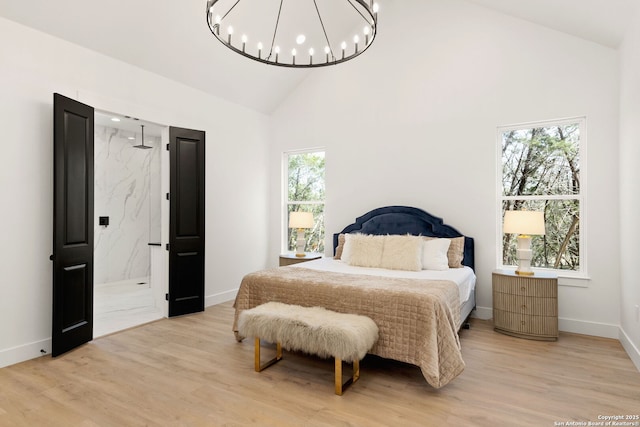 bedroom with a notable chandelier, baseboards, light wood-style floors, and high vaulted ceiling