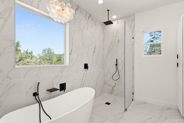 bathroom with a marble finish shower, recessed lighting, marble finish floor, and a freestanding tub