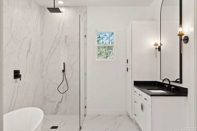 full bathroom featuring a marble finish shower, baseboards, a freestanding tub, marble finish floor, and vanity