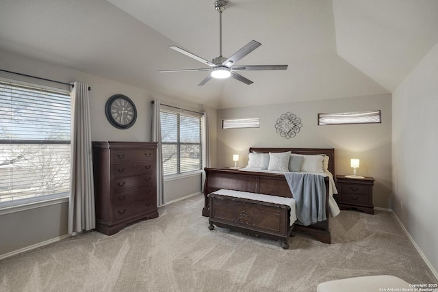 bedroom with baseboards, light colored carpet, ceiling fan, and vaulted ceiling