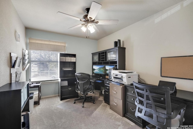 office space featuring light colored carpet and a ceiling fan