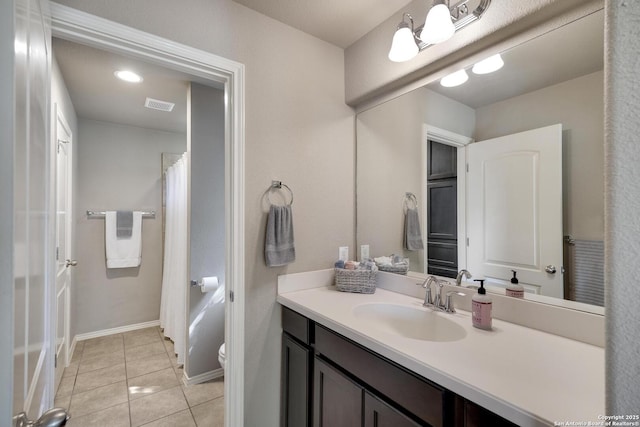 full bathroom featuring visible vents, baseboards, toilet, tile patterned floors, and vanity