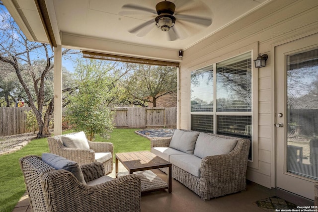 view of patio featuring ceiling fan, a fenced backyard, and outdoor lounge area