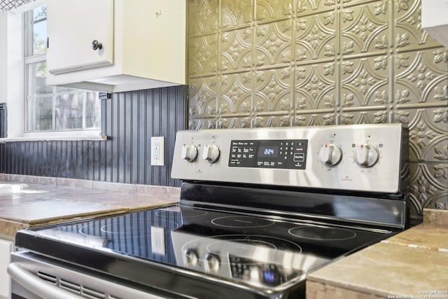 interior details featuring stainless steel electric range