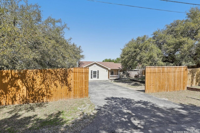 view of street with aphalt driveway