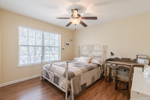 bedroom with wood finished floors, baseboards, and ceiling fan