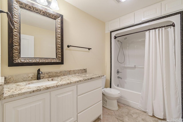 full bath featuring tile patterned floors, shower / tub combo with curtain, vanity, and toilet