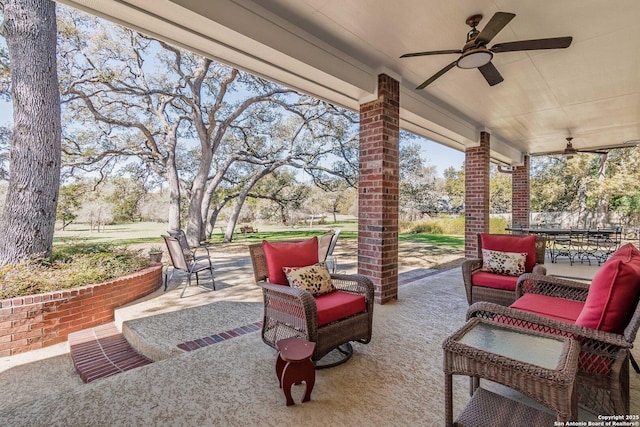 view of patio featuring outdoor dining space and ceiling fan