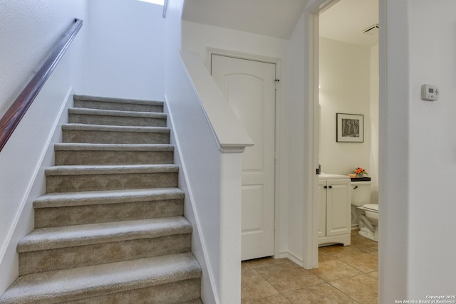 staircase with tile patterned flooring