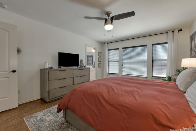 bedroom featuring a ceiling fan and wood finished floors