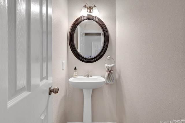 bathroom with a textured wall