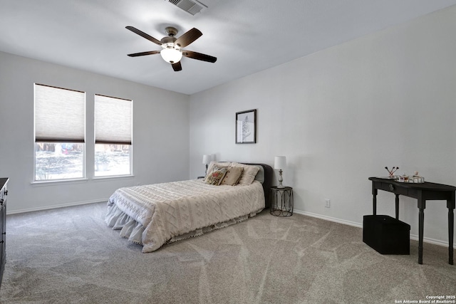 carpeted bedroom featuring visible vents, a ceiling fan, and baseboards