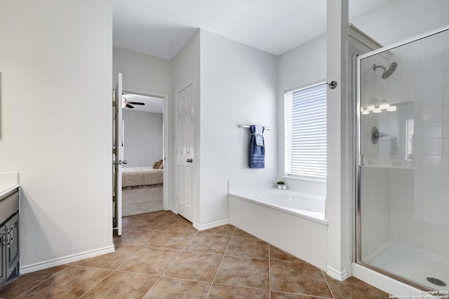 ensuite bathroom with vanity, a stall shower, tile patterned flooring, ensuite bathroom, and a garden tub