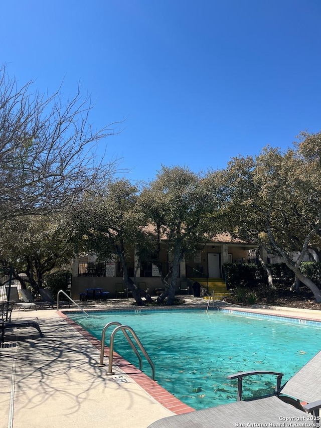 community pool with a patio