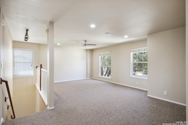 carpeted spare room featuring a ceiling fan, recessed lighting, visible vents, and baseboards