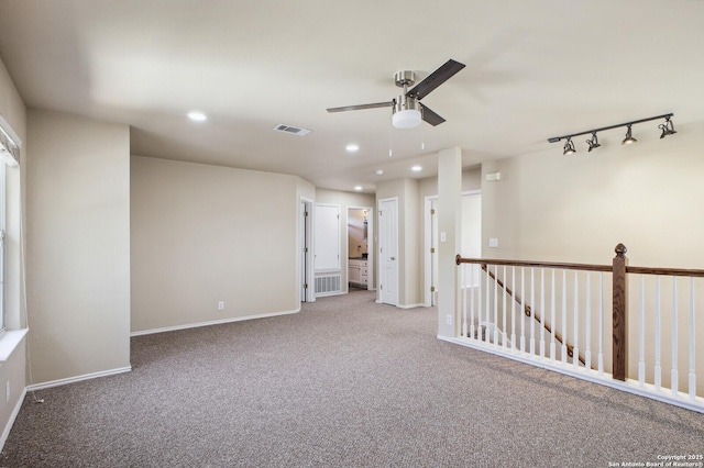 empty room featuring recessed lighting, visible vents, carpet flooring, and baseboards