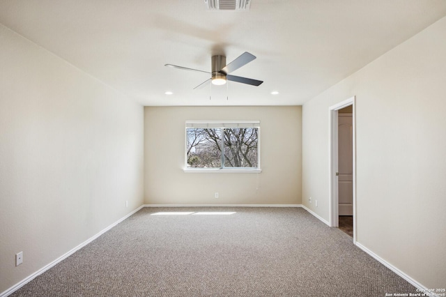 carpeted spare room with a ceiling fan, recessed lighting, baseboards, and visible vents