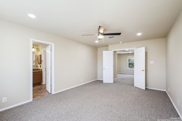 unfurnished bedroom with recessed lighting, visible vents, carpet floors, and baseboards