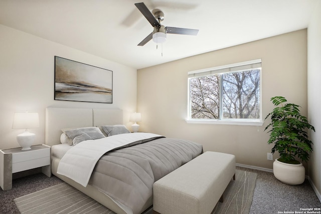 carpeted bedroom with baseboards and ceiling fan