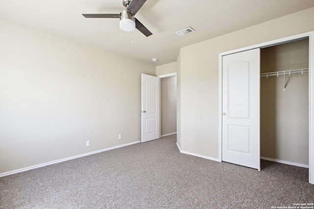 unfurnished bedroom with visible vents, a closet, carpet, baseboards, and ceiling fan